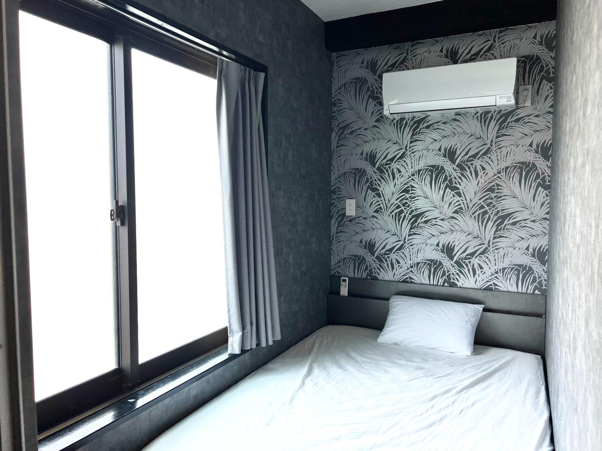 ゲストハウス Joooy Hotel 奄美 Amami Bagian luar foto